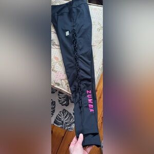Small black Zumba leggings with open zig zag on both legs